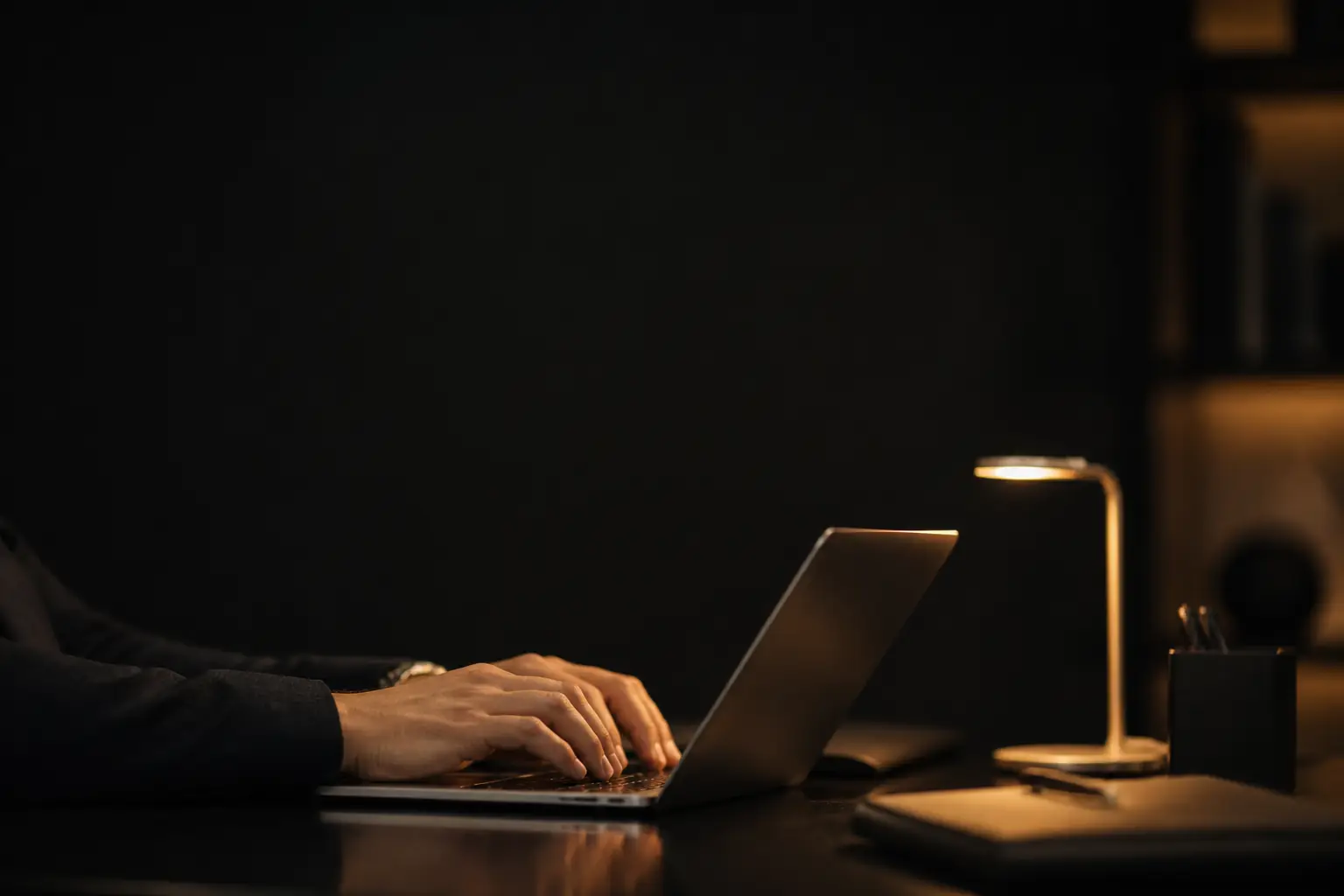 Person typing a message on a laptop to contact Shilohs Group